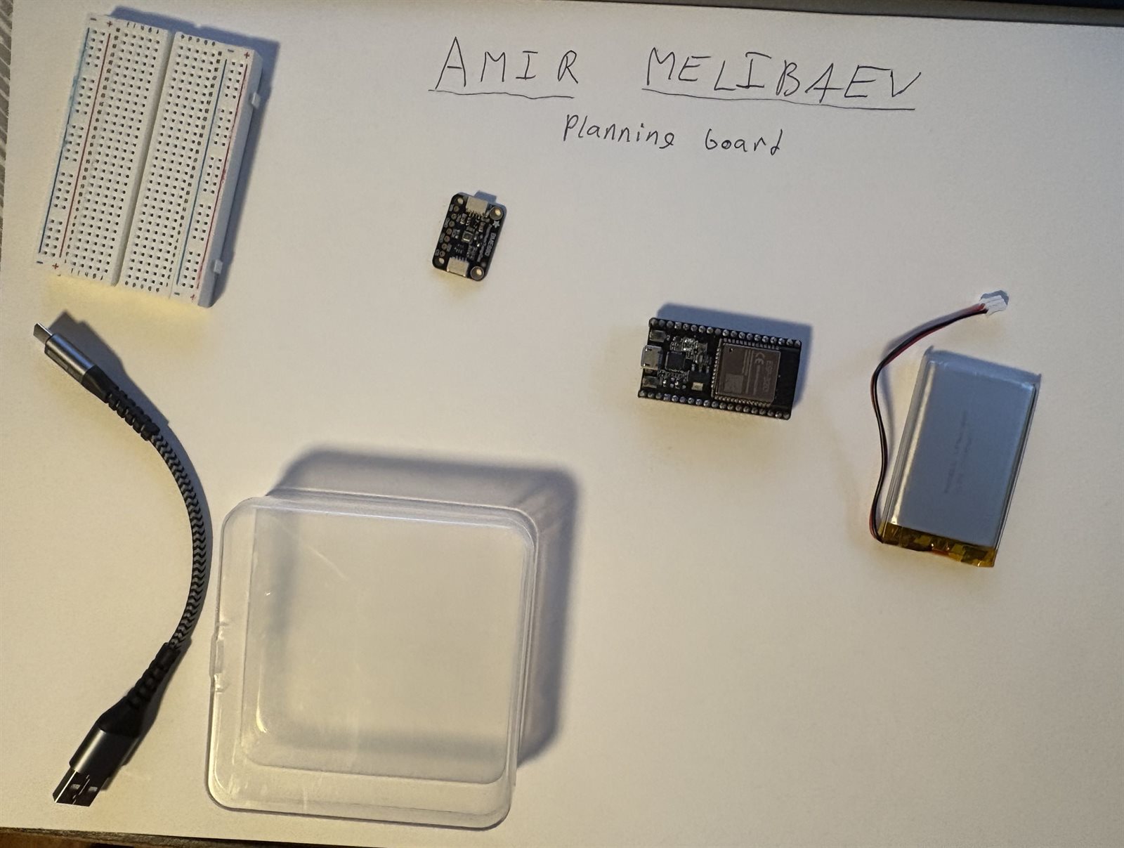 Planning board for weather station with ESP32, sensor, breadboard, and plastic container housing